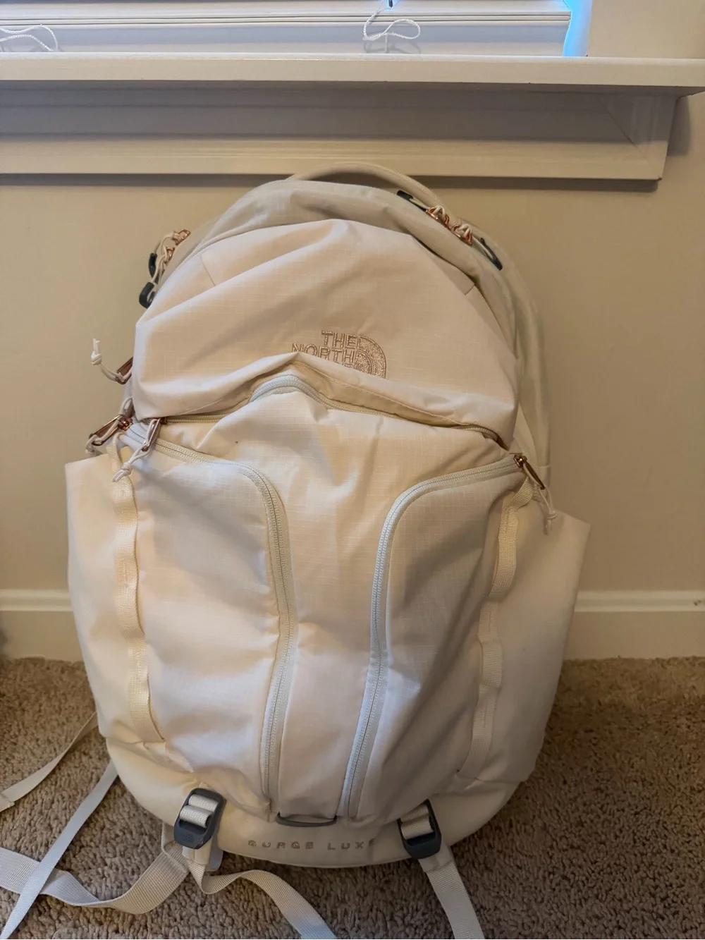 The North Face Surge Lux Backpack in Cream with Rose Gold(good as new 90%)